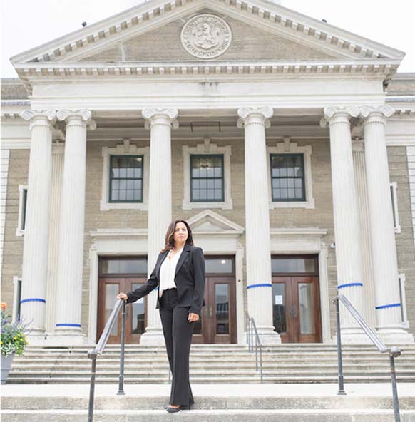 Photo of attorney Anne Zeitoun-Sedki standing on courthouse stairs